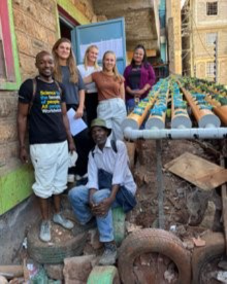 A group of people posing for a photo

AI-generated content may be incorrect.